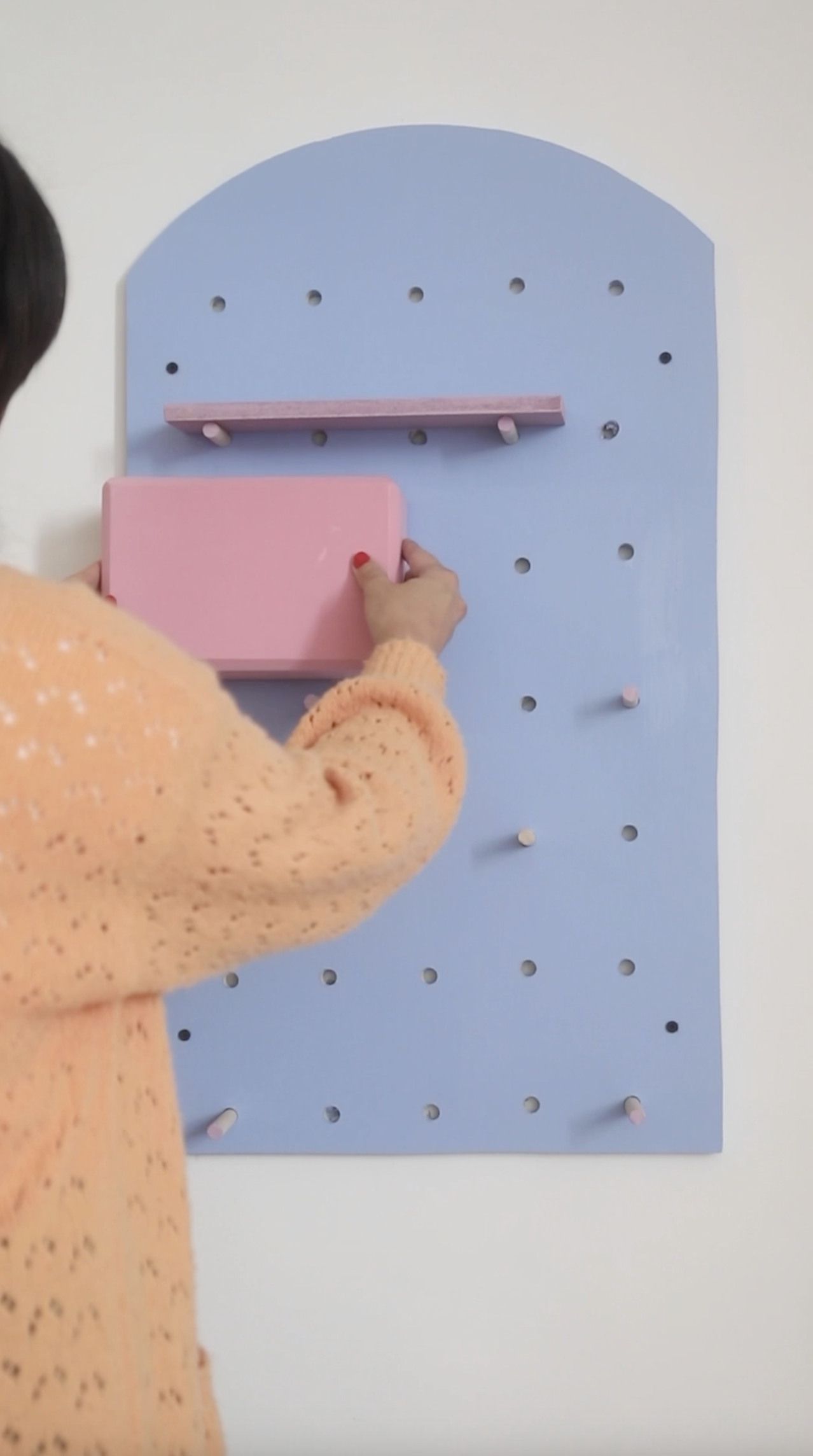 a pink yoga block placed in a pilates organizer