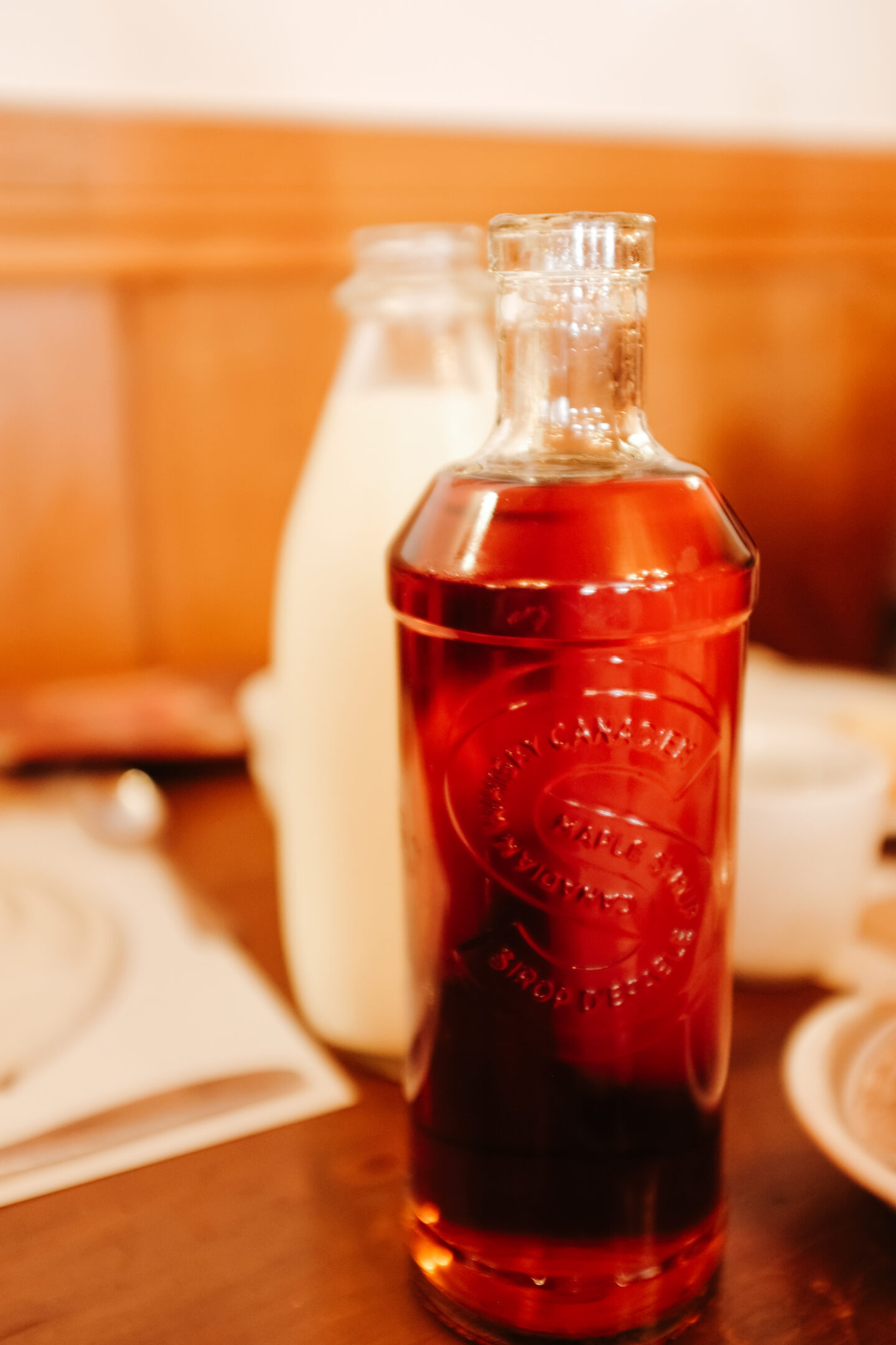 a bottle filled with fresh maple syrup