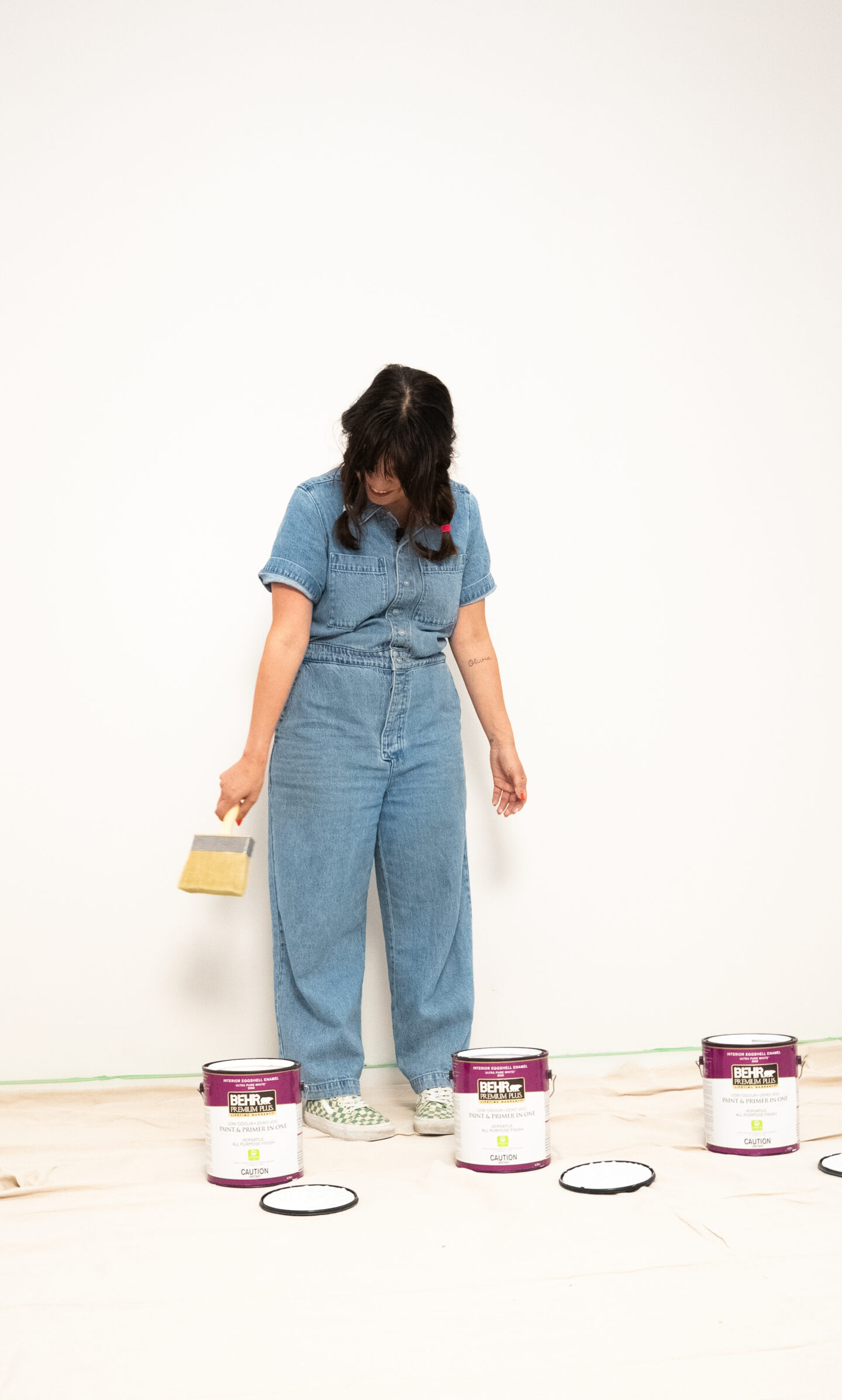 Mom painting with a brush, showcasing creative parenting and artistic expression